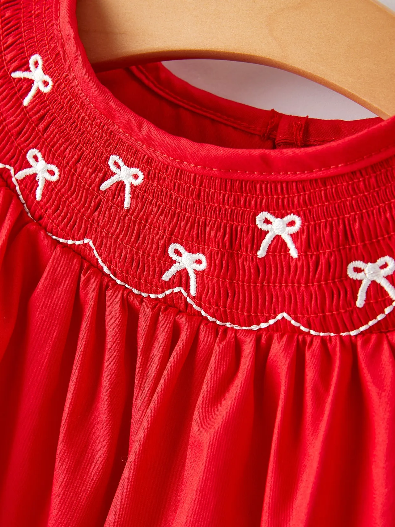Bow Smocked Romper in Red